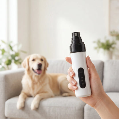 Hand holding the Sleekpaw quiet nail grinder with a relaxed dog nearby