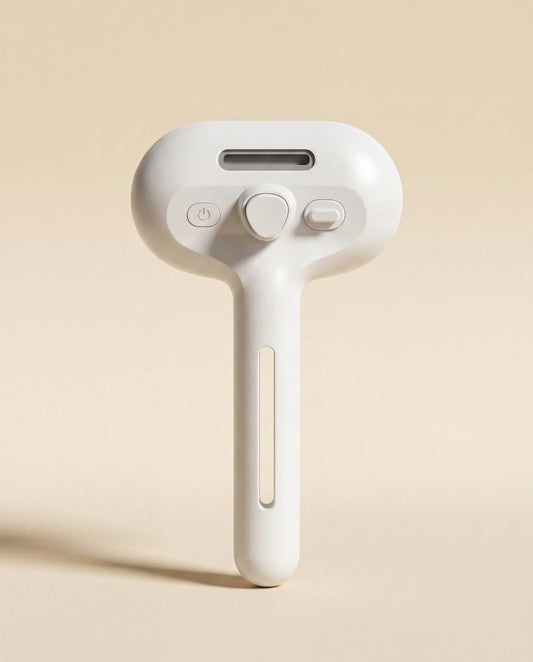 Sleekpaw Self-Cleaning Mist Pet Comb in white — front view with one-press fur release button
