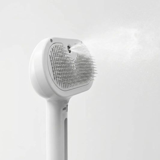 Sleekpaw comb spraying a fine mist of water vapor to soothe the coat